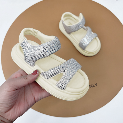 "Fashionable girls' sandals with an elegant shine and comfortable design"