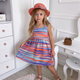 Girls' colorful summer dress with a stylish hat and a large bow tie