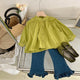 Stylish girls outfit with a modern touch - loose olive blouse with attractive pleated jeans